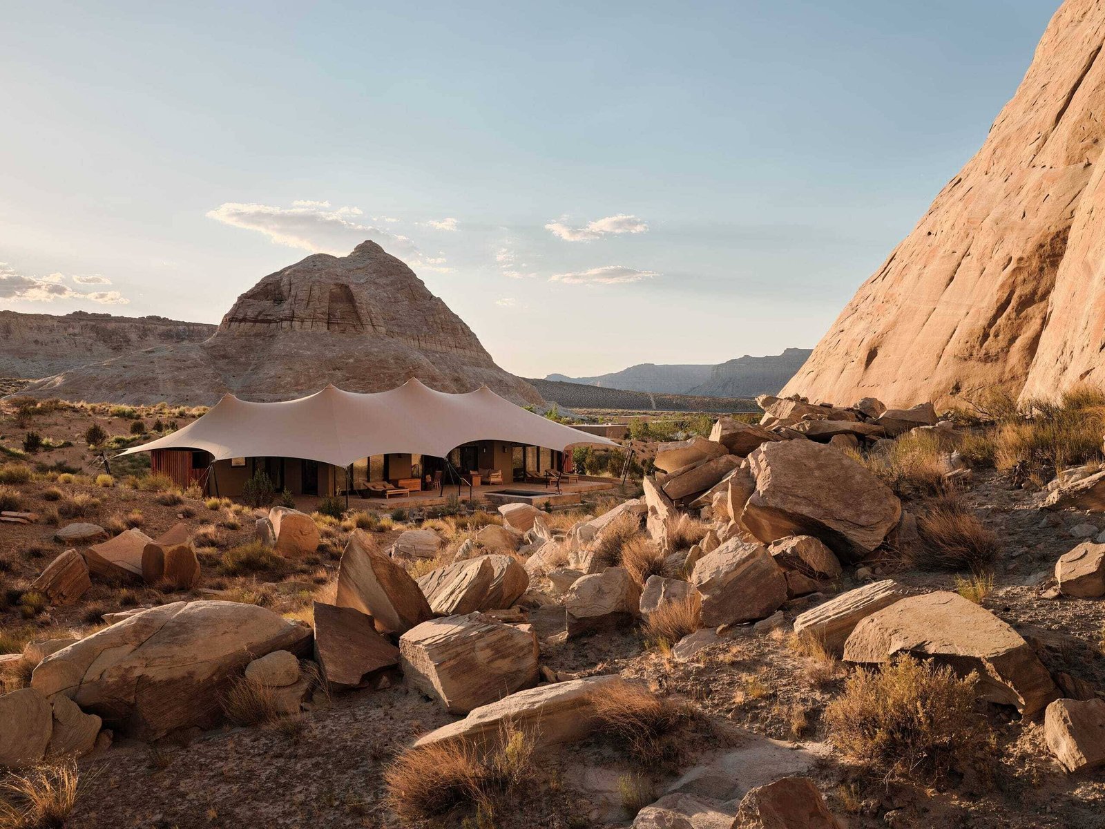A tented pavilion set among sandstone monoliths in the Utah desert at Amangiri